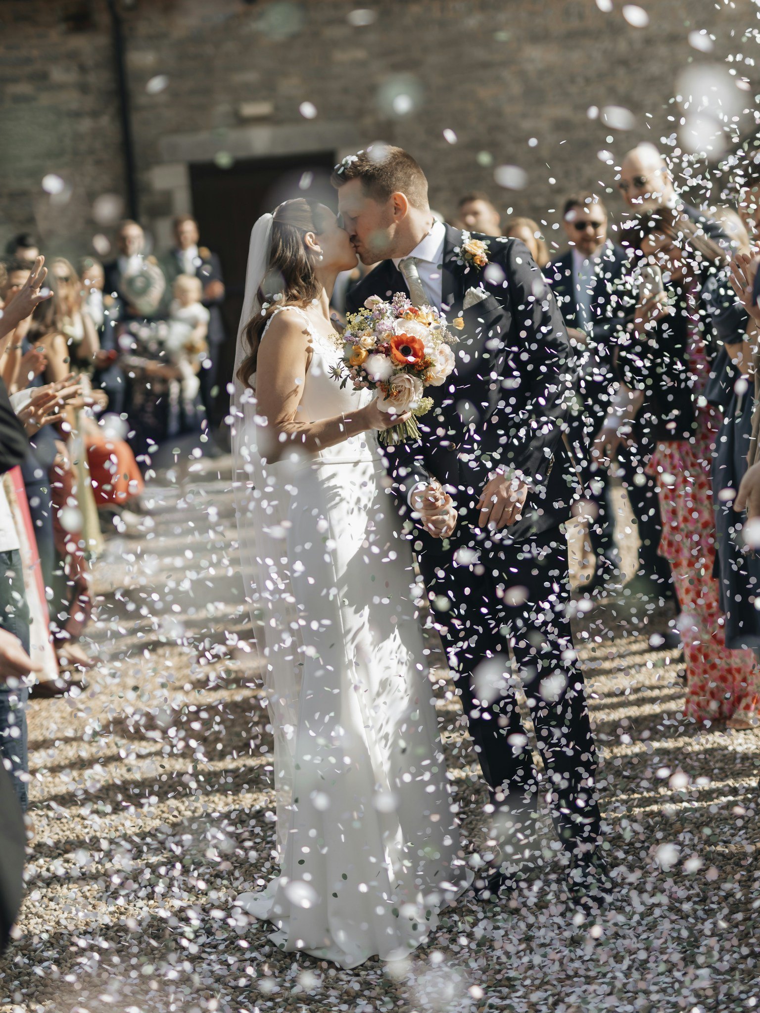 Newlyweds celebrating with their wedding guests
